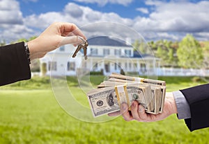 Handing Over Cash For House Keys in Front of Home