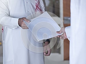 Handing Over A Document to a fellow employee