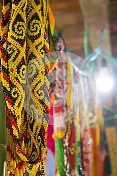 The handiwork of the Dayak tribe made of yellow beads
