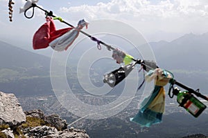 Handkerchiefs, bracelets and various objects left by tourists on the rope at the top of Innsbruck.