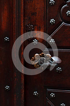 handle and keyhole on an old wooden door