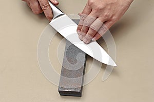 Handle the knife to make a sharp knife with a whetstone.