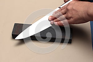 Handle the knife to make a sharp knife with a whetstone.