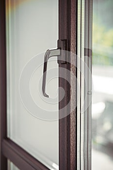Handle of modern plastic window. Closeup shot