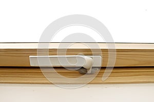 Handle of new Roof window. The typical windows applied to the sloped ceiling photo