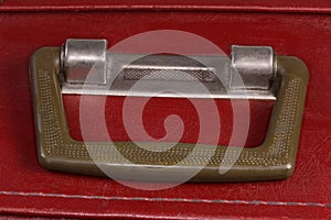 Handle of the old hardshell suitcase close-up
