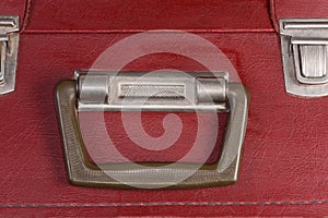 Handle of the old hardshell suitcase close-up