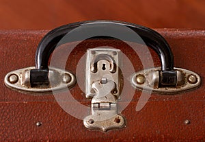 Handle of an Old Vinatge Dusty Brown Suitcase