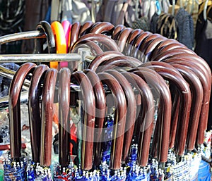 handles of closed umbrellas for sale in the stall of the bazaar photo