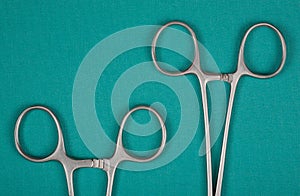 Handles medical clamps on a green background
