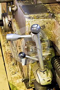 Handles of metal lathe machine close up