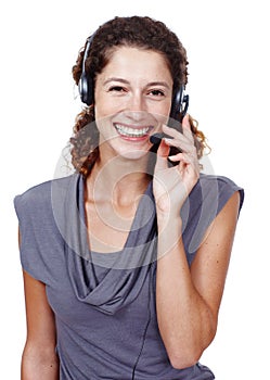 Handling customers like a pro. Studio shot of a friendly female customer service representative wearing a headset.