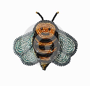 Handmade accessory brooch - golden bee with silvery wings, six legs and antennae, isolated on white, home hobby