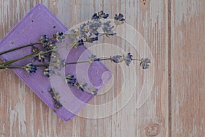 Handmade aromatic spa lavender soap. Natural additives and extracts. Bar of lavender soap with dried flowers. Beauty