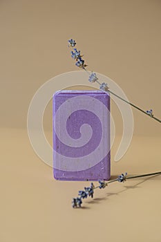 Handmade aromatic spa lavender soap. Natural additives and extracts. Bar of lavender soap with dried flowers. Beauty