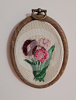 Handmade artwork using colored cotton embroidery threads.