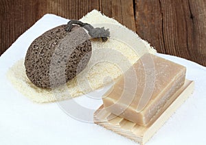 Handmade bar of soap, pumice stone and washcloth