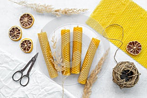 Handmade beeswax honey aroma candles with honeycombs, top view