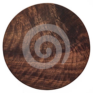 Handmade black walnut round wooden chopping board. Walnut round wooden pallet. Black walnut wood plank texture background.