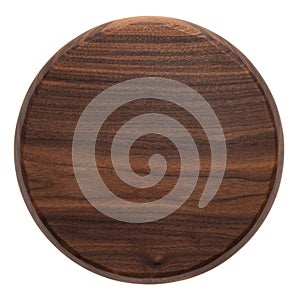 Handmade black walnut round wooden chopping board. Walnut round wooden pallet. Black walnut wood plank texture background.