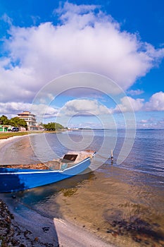 Handmade boat in the lake in summer day.