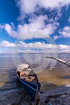 Handmade boat in the lake in summer day.