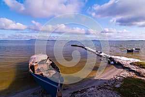 Handmade boat in the lake in summer day.