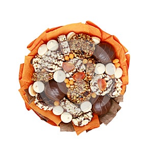 Handmade bouquet of marshmallows in chocolate, marmalade and gozinaki on a white background, top view