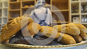 Handmade bread loaves on the counter top of a modern bakery