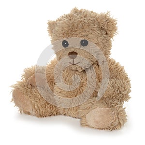 Handmade brown teddy bear on white background.