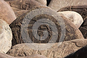 Handmade buddhist mantra on stones