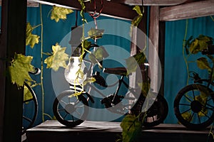 Handmade bycycle with baskets of flowers light focus on bycyle photo