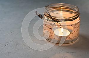 Handmade candle holder in a jar with paper decoupage, heart shaped hole, burning tea light, twine, dry flower twig, Valentine