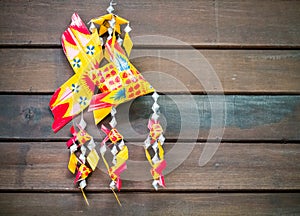 Handmade carp wicker on wooden background