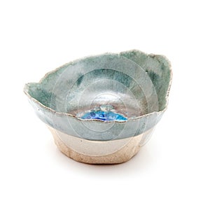 Handmade ceramic pinch pot on white photo