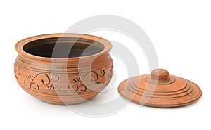 Handmade ceramic pot and matching lid displayed on clean white surface