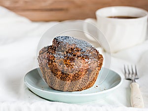 Handmade chocolate muffins with carob, honey, raisins and poppy