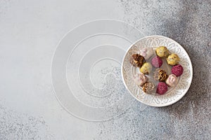 Handmade chocolates on stone background