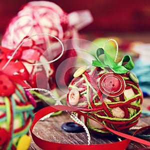 Handmade christmas balls, made with, cords, ribbons and buttons