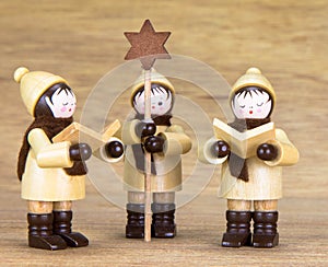 Handmade Christmas figure with a wooden background, made in the Erzgebirge, Germany
