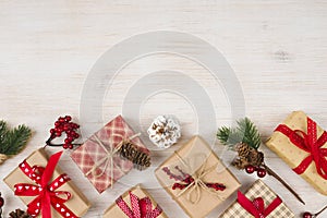 Handmade Christmas gift boxes and decoration on wooden texture background
