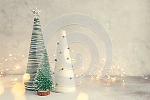 Handmade Christmas trees. Yarn wrapped cone trees and garland. Craft decorations to decorate your home during the