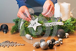 Handmade Christmas wreath with a star and greetings for Christmas under construction