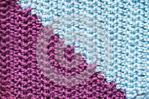 Handmade close-up simple lilac and blue crochet pattern