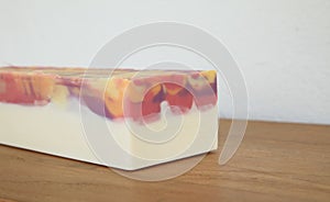 Handmade cold process peach soap on display photo