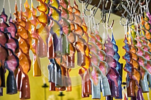 Handmade colored candles hung to dry