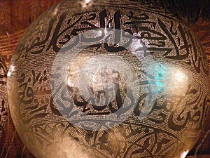 Shining Arabic copper lantern in khan el khalili souq with Quran arabic handwriting engraved on it photo