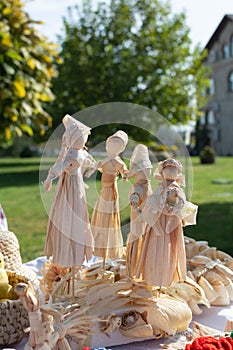 Handmade Corn husk doll. Exhibition of folk art. Culture of the Balkan peoples