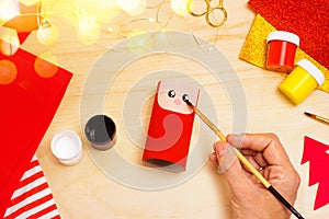 Handmade craft project from toilet tube. Creative kids DIY New year. Making cute Santa Claus for Christmas. Step by step