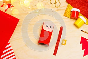 Handmade craft project from toilet tube. Creative kids DIY New year. Making cute Santa Claus for Christmas. Step by step